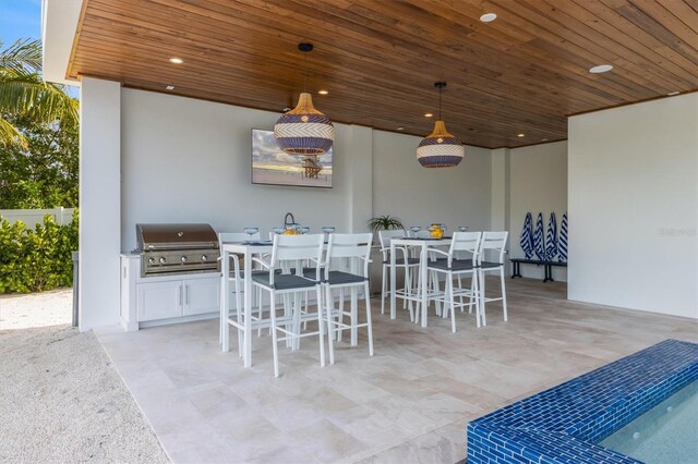 dining area with wood ceiling and a wealth of natural light