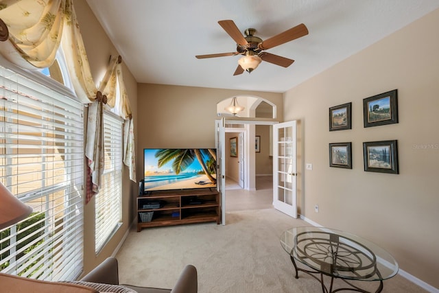 carpeted bedroom with french doors and ceiling fan