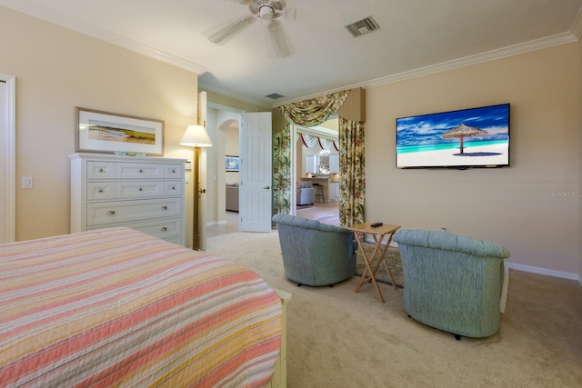 bedroom with carpet floors, ceiling fan, and ornamental molding