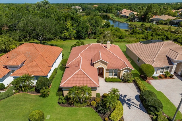 birds eye view of property with a water view