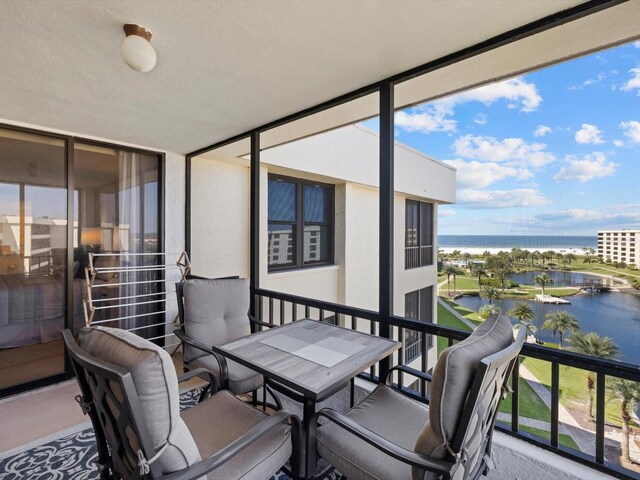 sunroom with a water view