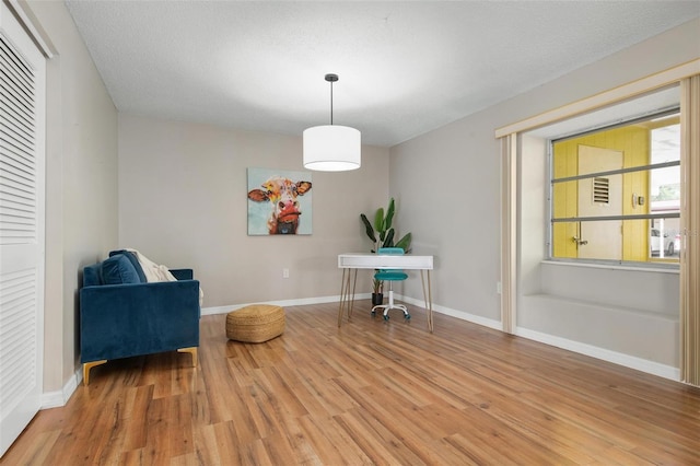 living area with light hardwood / wood-style floors