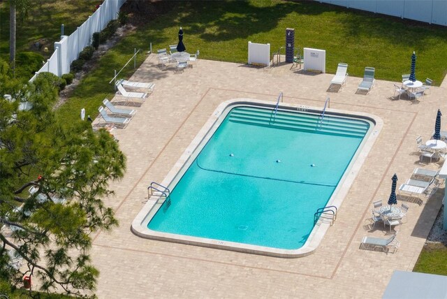 view of swimming pool featuring a patio area