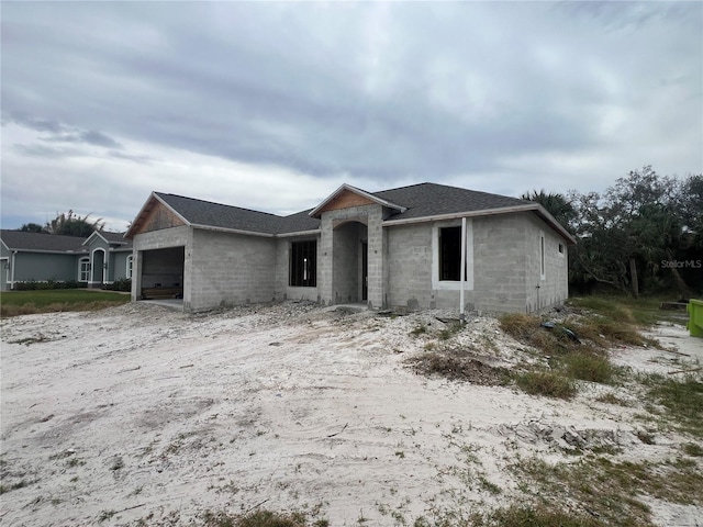 ranch-style house featuring a garage