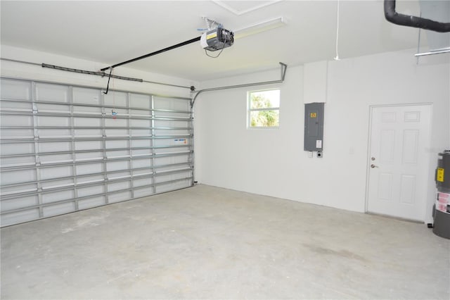 garage featuring a garage door opener, electric water heater, and electric panel