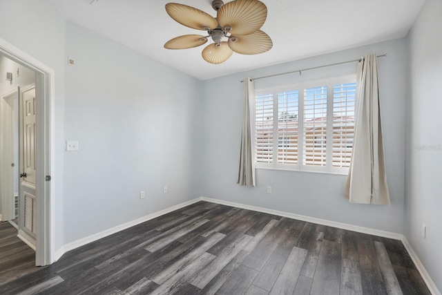 unfurnished room with ceiling fan and dark hardwood / wood-style floors