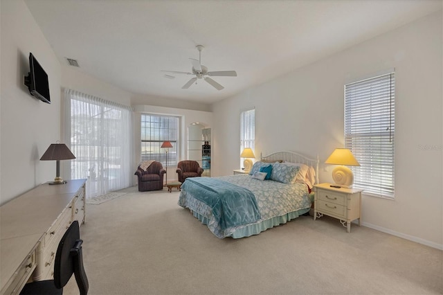 bedroom featuring ceiling fan and light carpet