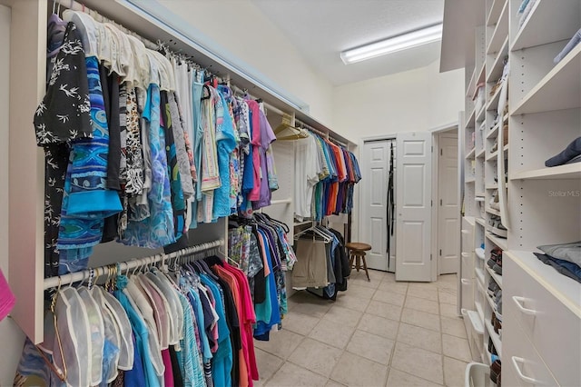 spacious closet with tile patterned flooring