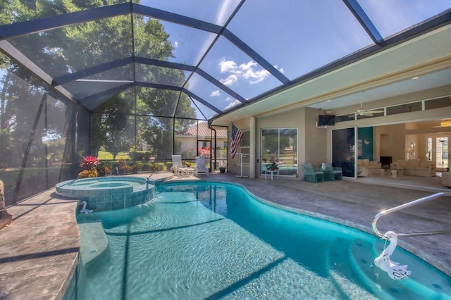 view of swimming pool featuring an in ground hot tub, a patio, ceiling fan, and a lanai