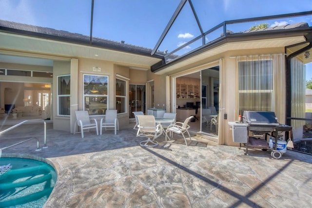 exterior space featuring a lanai and a grill