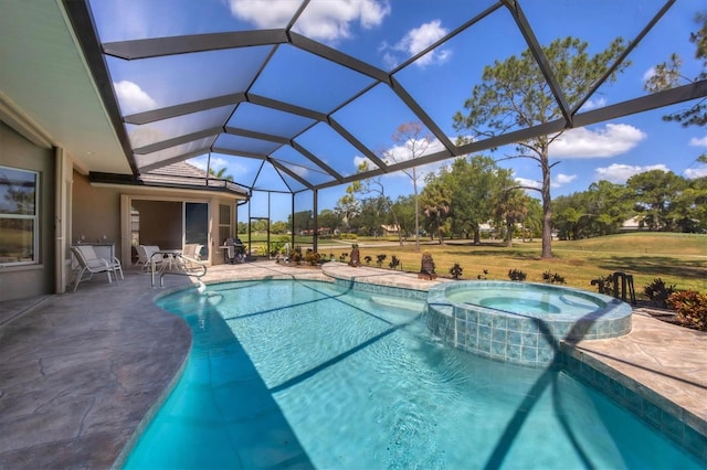 view of swimming pool with an in ground hot tub, a patio, and glass enclosure