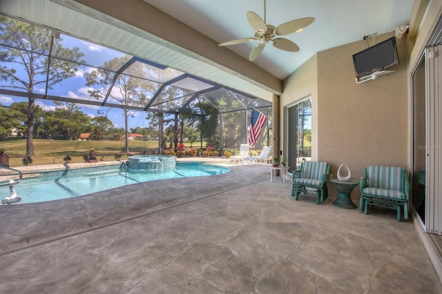 view of pool with an in ground hot tub, a patio, ceiling fan, and a lanai