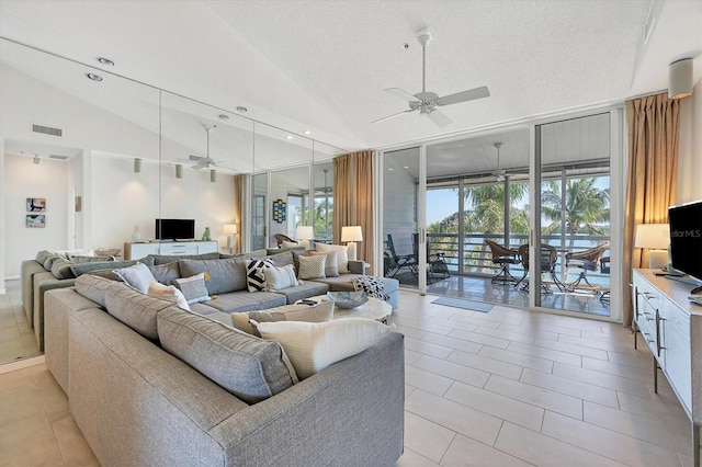 tiled living room featuring ceiling fan, high vaulted ceiling, and a textured ceiling