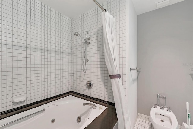 bathroom featuring tile patterned flooring, a bidet, and shower / bath combo with shower curtain