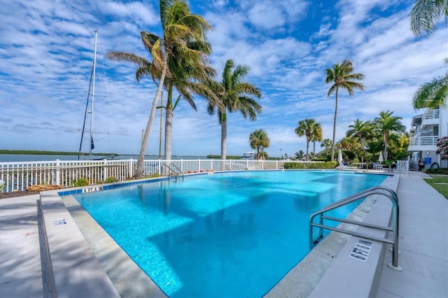 view of pool with a water view