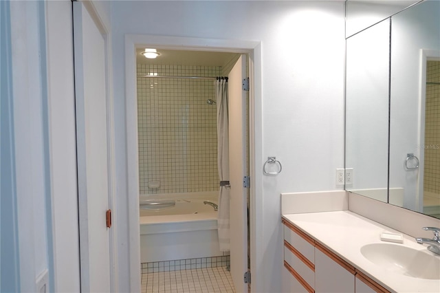 bathroom with vanity, tile patterned floors, and shower / bath combo with shower curtain