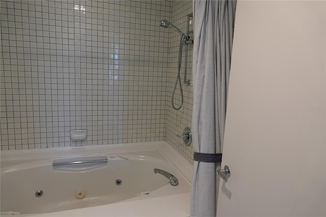 bathroom with shower / bathtub combination with curtain