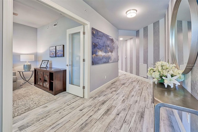 hallway featuring light hardwood / wood-style flooring