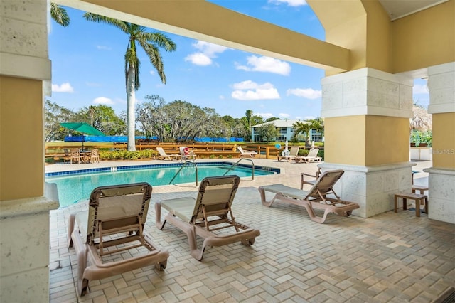 view of swimming pool featuring a patio area