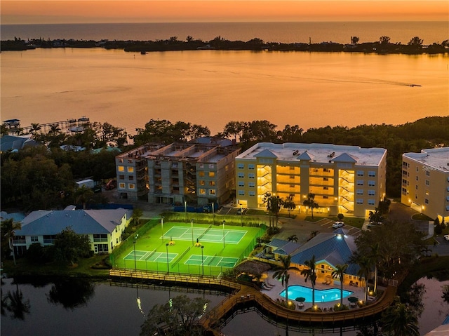 aerial view at dusk with a water view