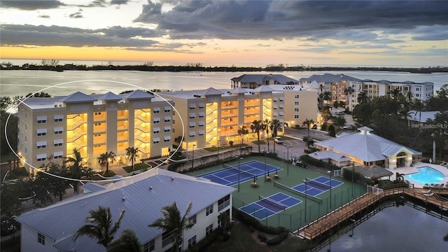 aerial view at dusk with a water view