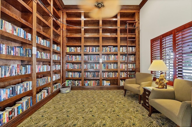 sitting room with wall of books and built in features