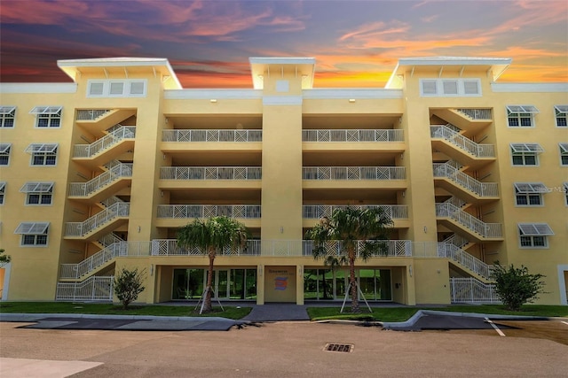 view of outdoor building at dusk