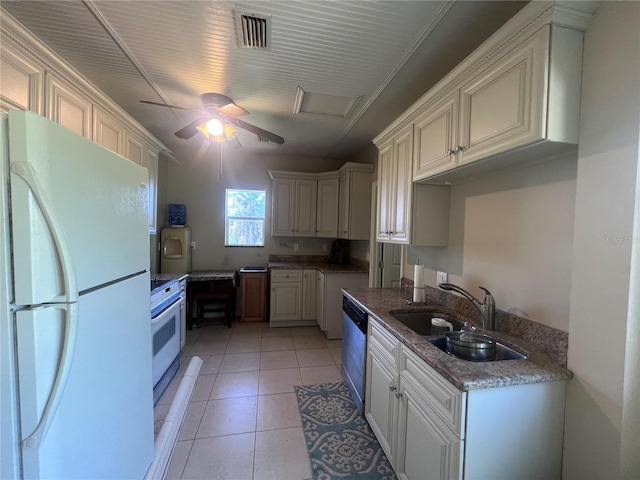 kitchen featuring white appliances, sink, ceiling fan, light tile patterned floors, and stone countertops