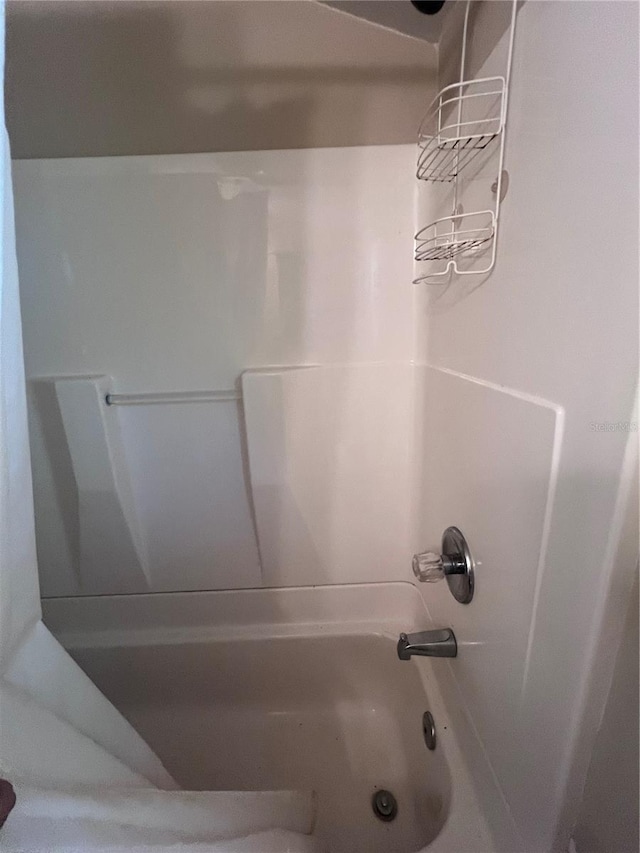 bathroom with washtub / shower combination