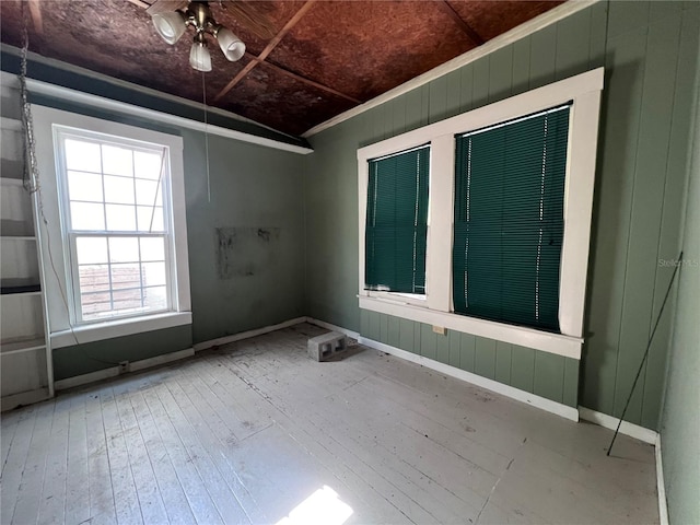 empty room featuring hardwood / wood-style floors and ceiling fan