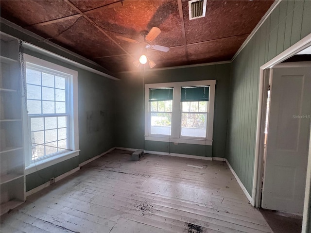 spare room featuring hardwood / wood-style flooring and ceiling fan