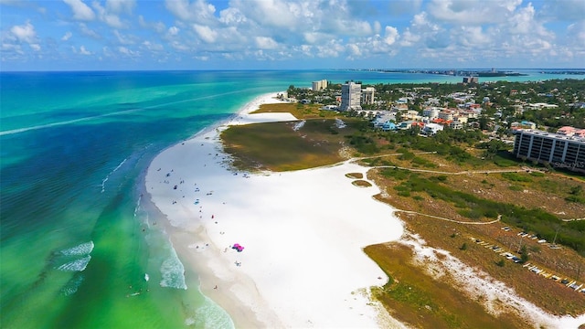 drone / aerial view featuring a water view and a beach view