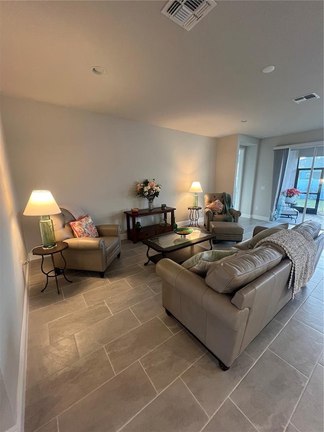 living room featuring visible vents and baseboards