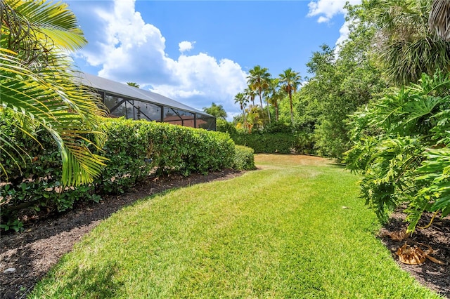 view of yard featuring glass enclosure