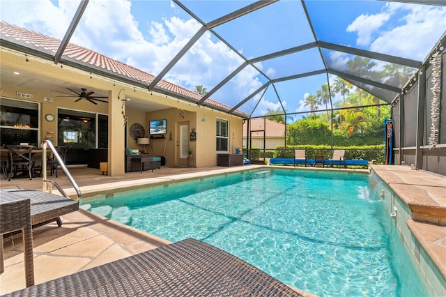 view of swimming pool with a lanai, ceiling fan, pool water feature, an outdoor hangout area, and a patio area