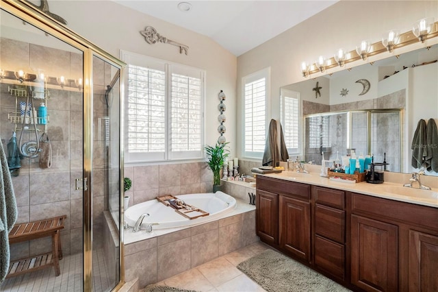 bathroom featuring tile patterned flooring, a healthy amount of sunlight, and separate shower and tub