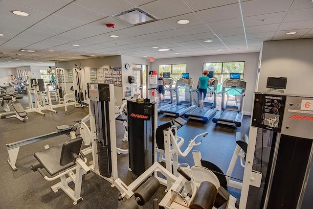 workout area with a paneled ceiling