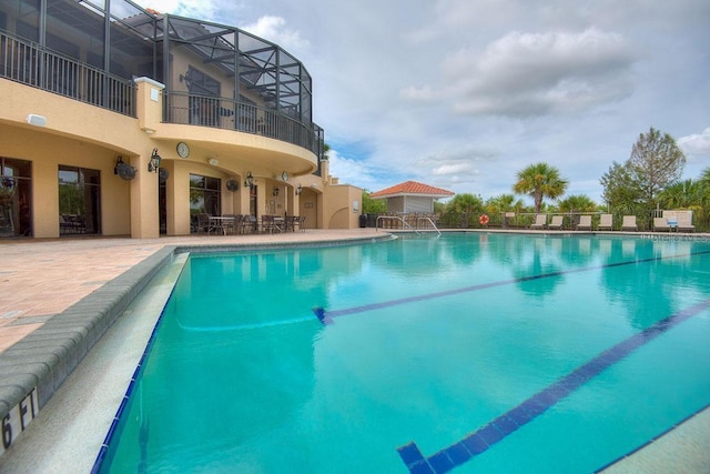 view of swimming pool with a patio area