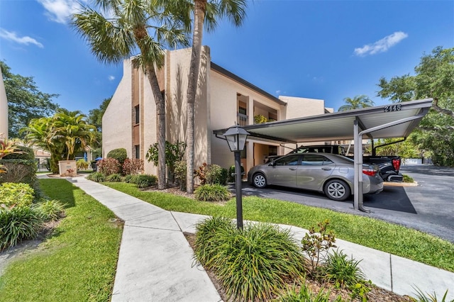 view of side of home featuring a carport