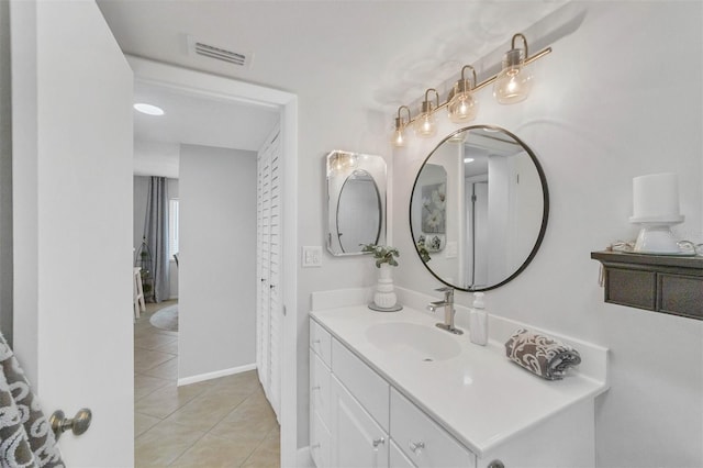 bathroom featuring vanity and tile floors