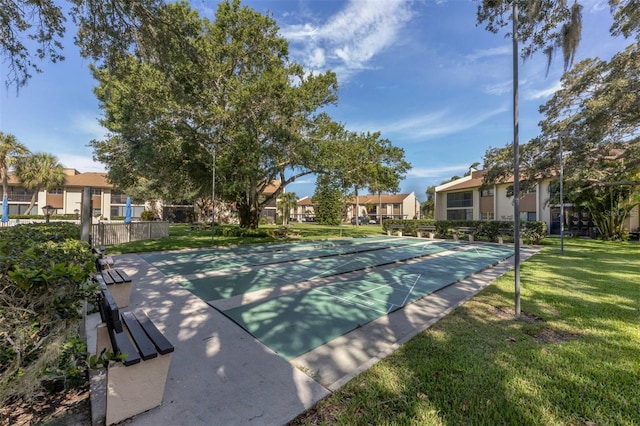 view of home's community featuring a yard