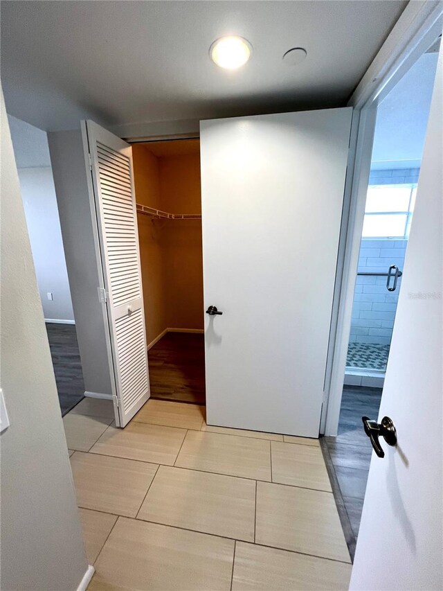 bathroom with tile patterned floors