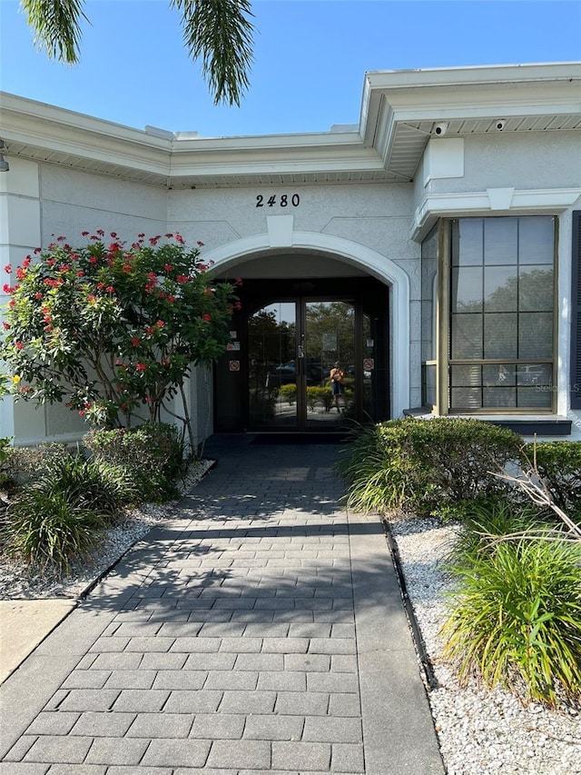 view of exterior entry featuring french doors