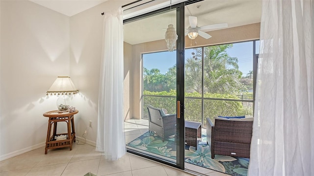 doorway to outside with ceiling fan and light tile flooring