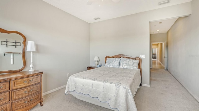 bedroom with light carpet and ceiling fan