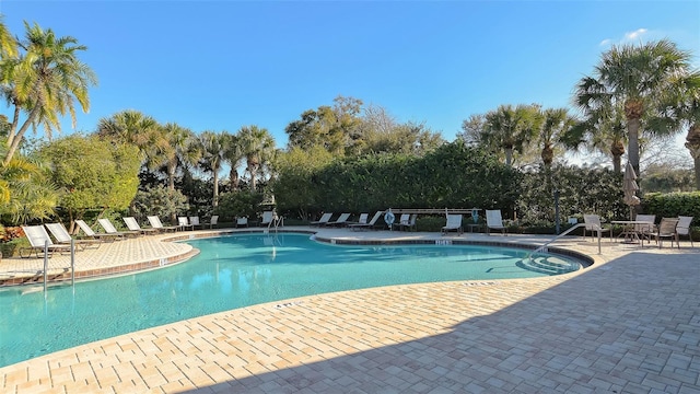 view of swimming pool featuring a patio area