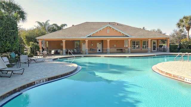 view of swimming pool with a patio area