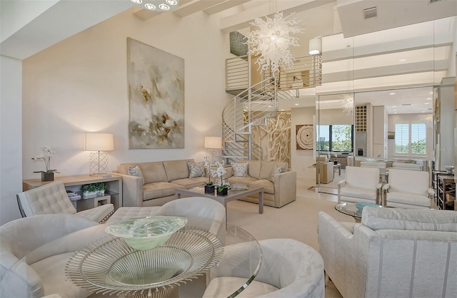 living room featuring light carpet, a chandelier, and a high ceiling