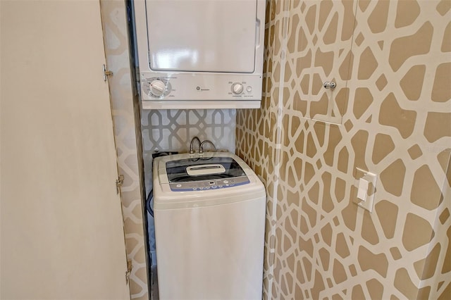 laundry area with stacked washer / dryer