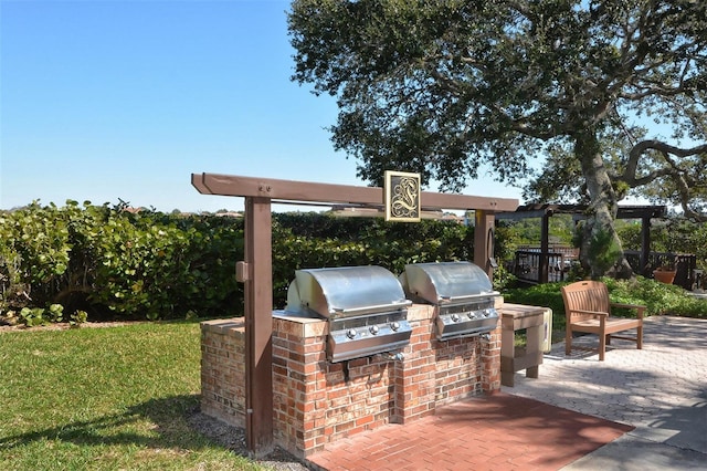 view of patio with a grill and an outdoor kitchen